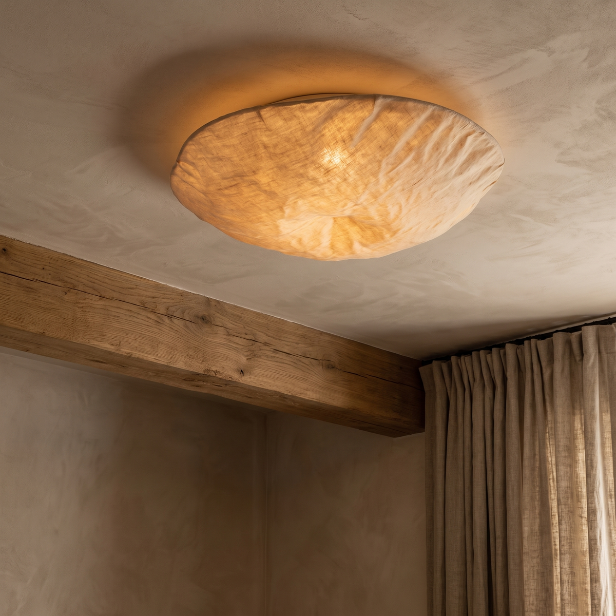 Silk ceiling light glowing in a calm bedroom